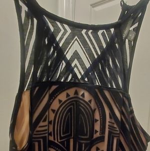 Curve hugging little black sleeveless dress